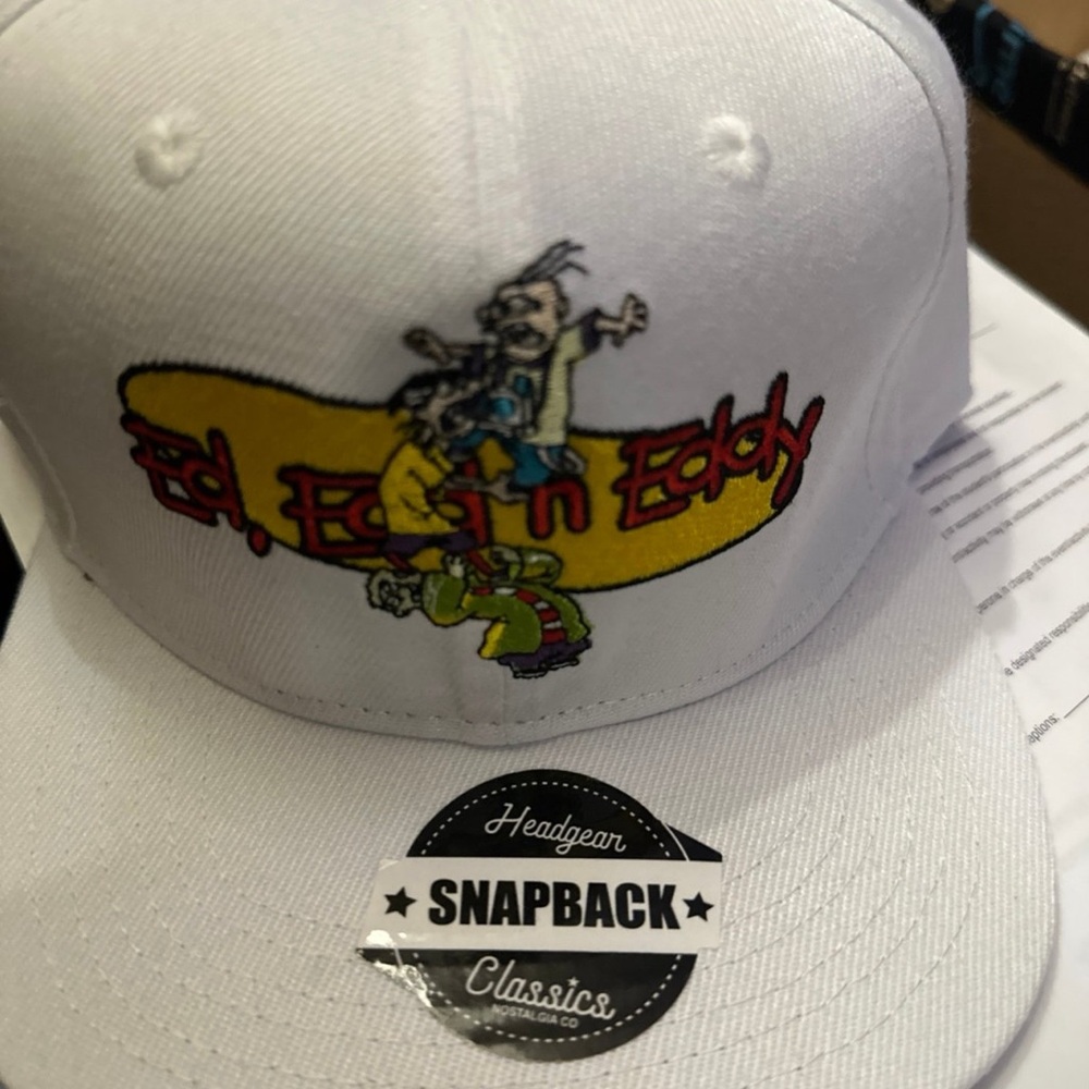 White Snapback Hat with Cartoon Graphic